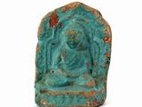 an image of a turquoise stone statue of a buddha