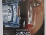 the poster for the movie solaris is hanging on the wall