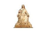 statue de Jésus assis sur un trône, tenant une croix dans la main