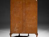 an old wooden cabinet sitting on top of a white floor