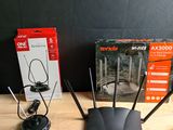two wireless devices are sitting on a table next to a box of wires
