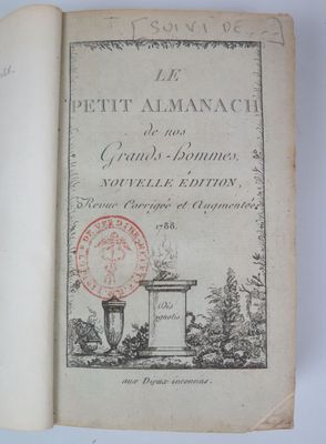 an old book with a stamp on it sitting on a table