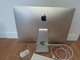 an apple computer with a keyboard and mouse on the floor