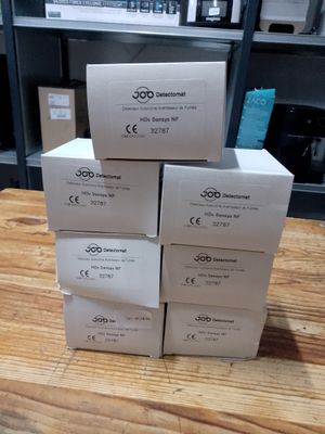 several boxes stacked on top of each other on a wooden table