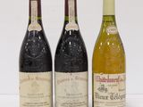three bottles of wine sitting next to each other on a table