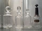 many glass bottles that are lined up on a table