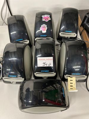 six black toasters sitting next to each other on a table