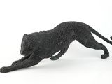 figurine of a black cat on a white background