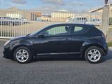 a picture of a black car parked in a parking lot