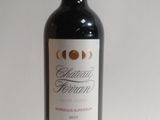 a bottle of wine that is sitting on a table