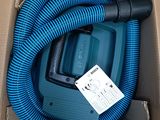 a blue hose in a box with a tag on it