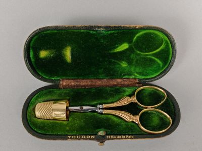 a pair of scissors and a pair of scissors in a case