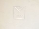a white wall with a sign on it that says i love you