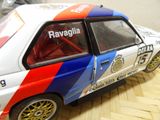 a toy car that is sitting on a wooden floor