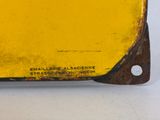 an image of a close up of a yellow piece of metal