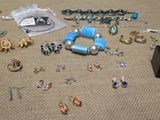 many different types of jewelry on a table