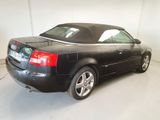 a black car that is parked in a garage