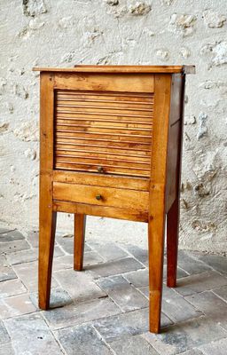 a small wooden table with a drawer on top of it