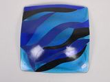 blue and black glass plate with a zebra print design on it