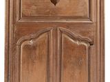 an image of a wooden cabinet with a heart on the door