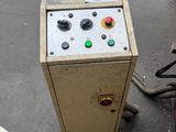 a machine that is sitting on the floor in the garage