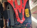 a box full of assorted toy cars and other items