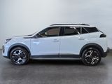 the white suv is parked in a room with a gray floor