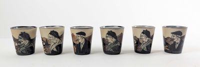 six shot glasses with a picture of a man and a woman on them