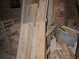 several pieces of wood are stacked in a pile in a room