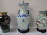 three vases that are sitting on a table