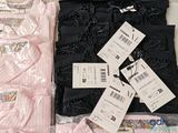 a pile of clothing that is sitting on a table