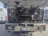 a truck that has a large engine in the back of it