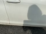 a shadow of a person on the side of a car
