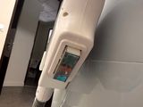 a hair dryer that is attached to a wall in a room