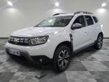 a picture of a white dacia parked on a checkered floor