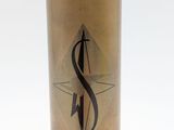 a gold container with a black and white logo on it