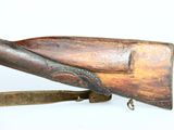 an old rifle with a wooden handle on a white background
