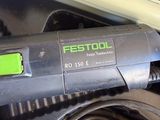 a black and green electric tool sitting on top of a table