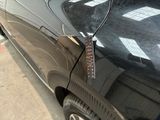 a close up of a car with a remote control attached to it
