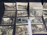 several old black and white photographs of people and buildings on a table