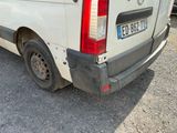 a white van that is parked in a parking lot