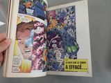 a person holding a comic book open on a table