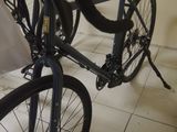 a bicycle that is sitting on the floor in the room