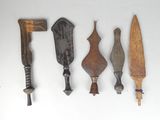 several different types of knives are lined up on a white surface