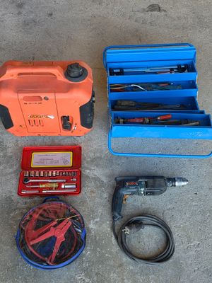 many tools laid out on the floor next to each other