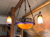 a chandelier hanging from the ceiling in a restaurant