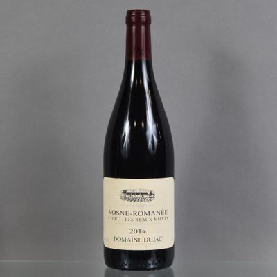 a bottle of wine that is sitting on a table