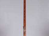an image of a wooden instrument on a clear surface