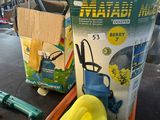a yellow boat sitting on a table next to a box