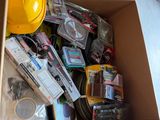 a cardboard box full of assorted items in a room